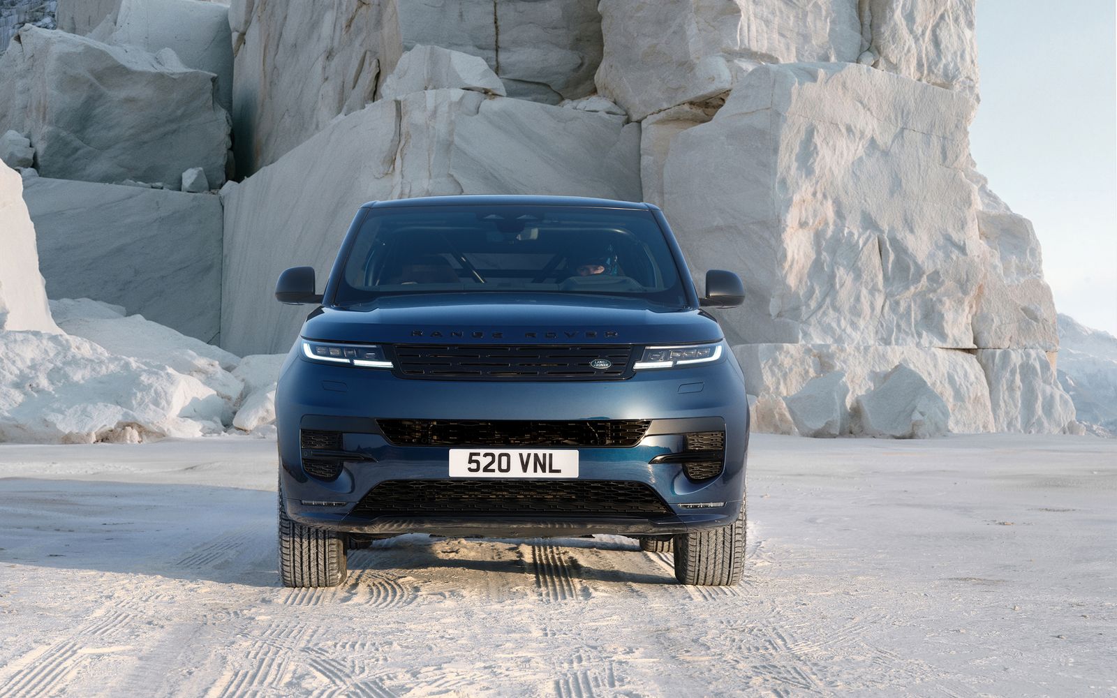 Range Rover Sport facing camera in a white stone quarry